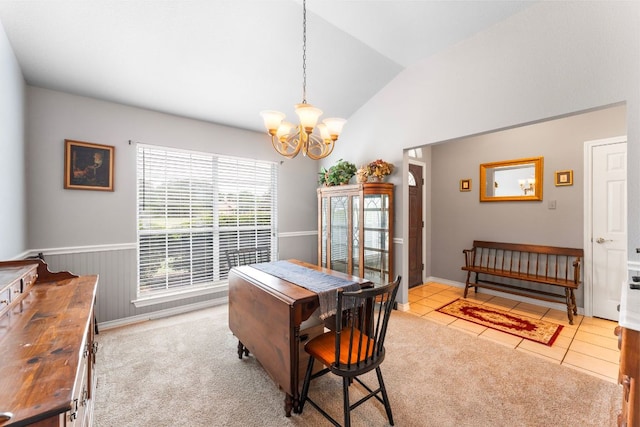 221 Breakaway Rd, Cedar Park, TX 78613 - tiled dining room with a chandelier, lofted ceiling, and a wainscoted wall