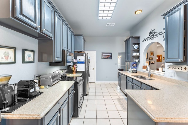 221 Breakaway Rd, Cedar Park, TX 78613 - kitchen with stainless steel appliances, a sink, light tile patterned floors, light countertops, and open shelves