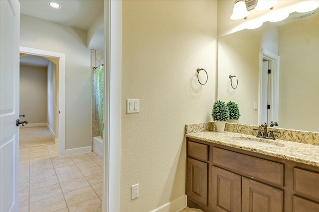 1036 Liberty Park Dr Unit 20, Austin, TX 78746 - bathroom featuring tile patterned flooring, vanity, shower / tub combo with curtain, and baseboards