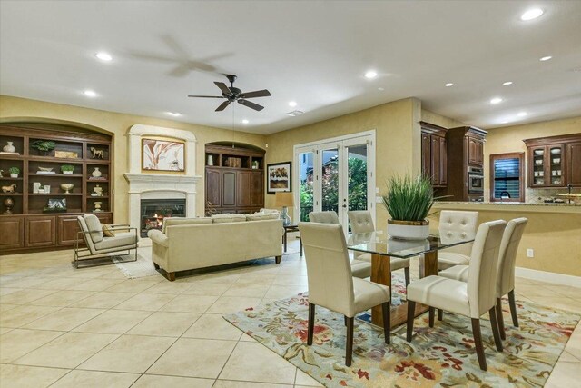 1036 Liberty Park Dr Unit 20, Austin, TX 78746 - dining space featuring light tile patterned flooring, recessed lighting, ceiling fan, and a lit fireplace