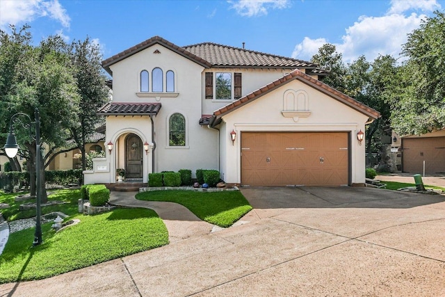1036 Liberty Park Dr Unit 20, Austin, TX 78746 - mediterranean / spanish home with concrete driveway, a tile roof, a front yard, stucco siding, and a garage
