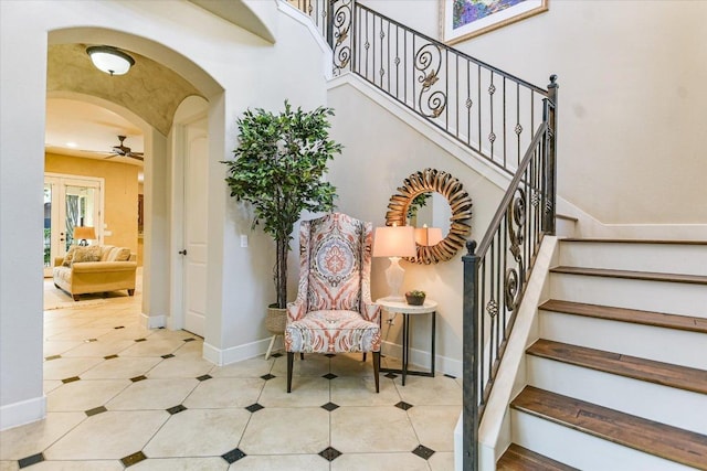 1036 Liberty Park Dr Unit 20, Austin, TX 78746 - stairs with arched walkways, a ceiling fan, baseboards, and tile patterned floors