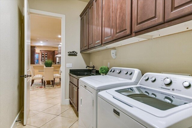 1036 Liberty Park Dr Unit 20, Austin, TX 78746 - laundry room with washer and dryer, light tile patterned flooring, cabinet space, baseboards, and recessed lighting
