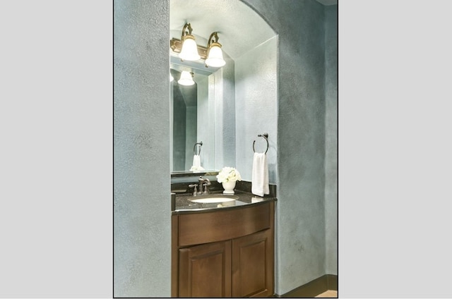 1036 Liberty Park Dr Unit 20, Austin, TX 78746 - bathroom featuring a textured wall and vanity