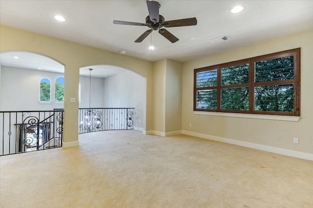 1036 Liberty Park Dr Unit 20, Austin, TX 78746 - unfurnished room with recessed lighting, a ceiling fan, carpet floors, baseboards, and arched walkways