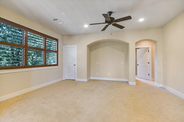 1036 Liberty Park Dr Unit 20, Austin, TX 78746 - empty room featuring arched walkways, light carpet, a ceiling fan, recessed lighting, and baseboards