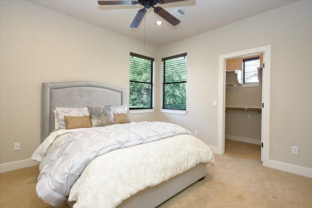 1036 Liberty Park Dr Unit 20, Austin, TX 78746 - bedroom with light colored carpet, multiple windows, and baseboards