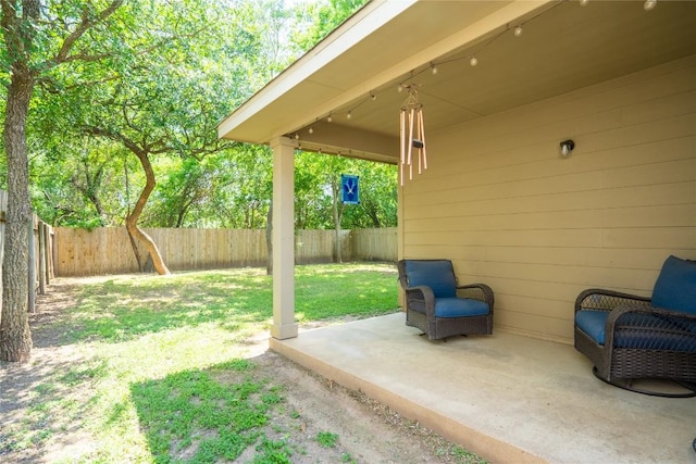 411 Tilly Ln, Buda, TX 78610 - fenced backyard with a patio