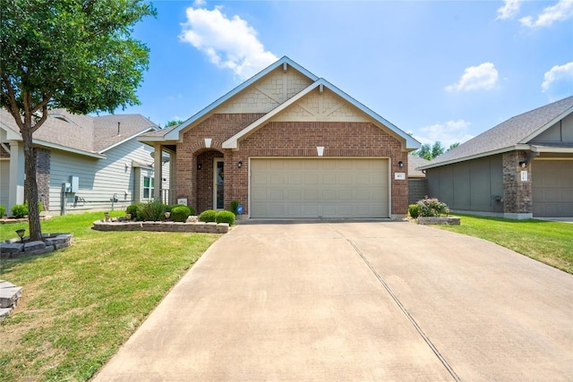 411 Tilly Ln, Buda, TX 78610 - view of front of house featuring brick siding, a front yard, and concrete driveway