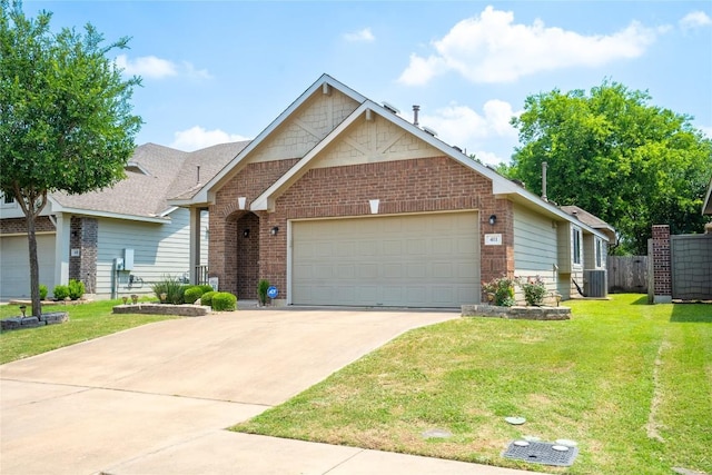 411 Tilly Ln, Buda, TX 78610 - view of front of home featuring a garage, driveway, and brick siding