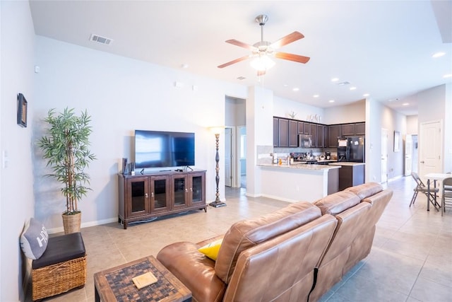 411 Tilly Ln, Buda, TX 78610 - living area featuring light tile patterned floors, a ceiling fan, and recessed lighting