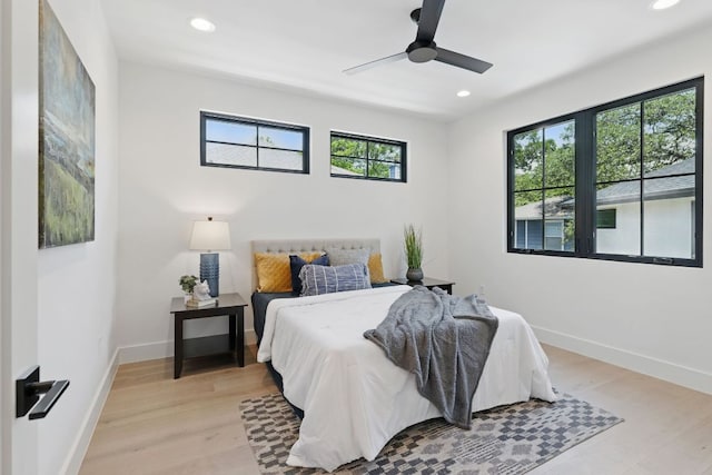 bedroom featuring recessed lighting, light wood-style flooring, baseboards, and ceiling fan