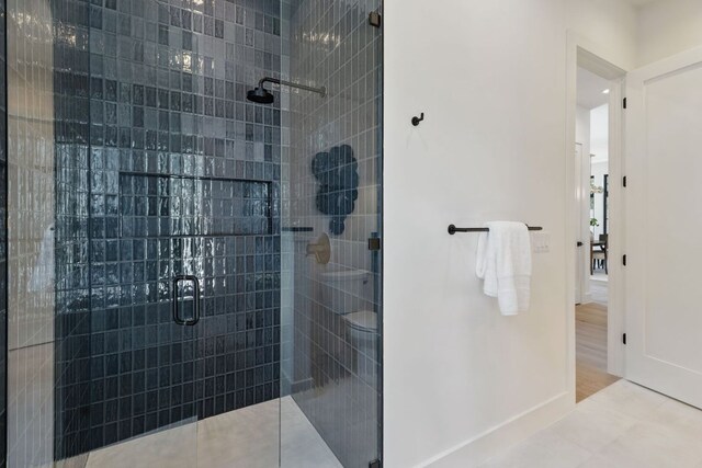 2304 W 8th, Austin, TX 78703 - full bathroom with a shower stall and baseboards