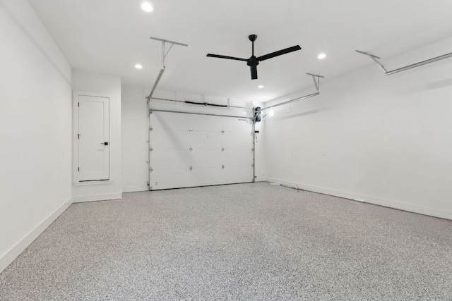 garage featuring recessed lighting and baseboards