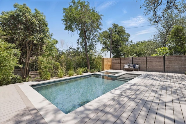 2304 W 8th, Austin, TX 78703 - view of swimming pool featuring a deck, a fenced backyard, and a pool with connected hot tub