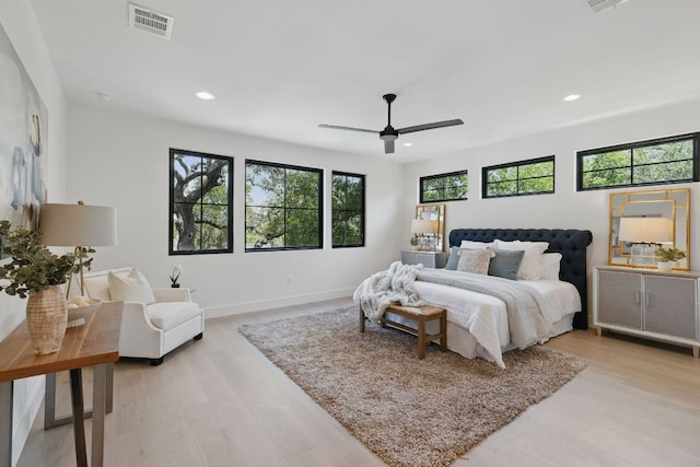 bedroom with recessed lighting, light wood finished floors, baseboards, and ceiling fan
