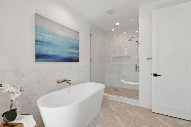 2304 W 8th, Austin, TX 78703 - bathroom featuring a freestanding tub, a shower stall, tile walls, and recessed lighting