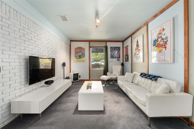 4819 Roundup Trl, Austin, TX 78745 - living area with brick wall and dark carpet