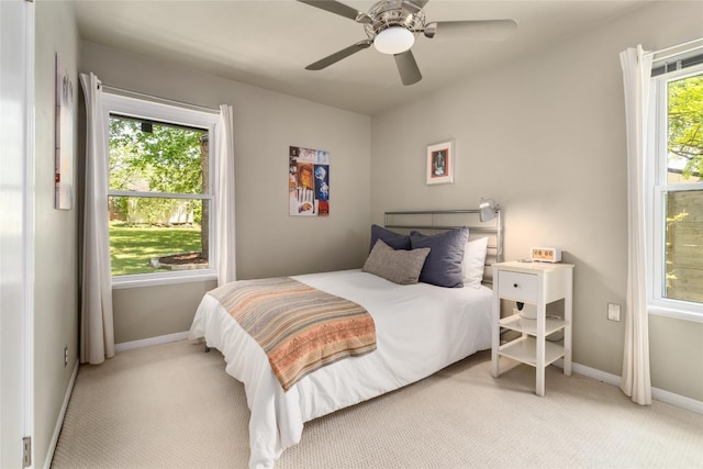 4819 Roundup Trl, Austin, TX 78745 - bedroom featuring light carpet, baseboards, and a ceiling fan
