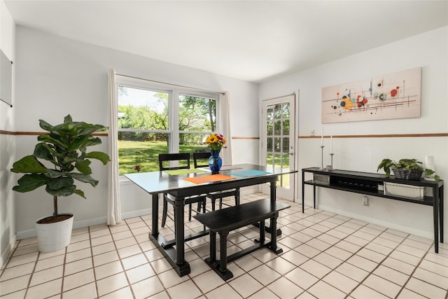 4819 Roundup Trl, Austin, TX 78745 - dining area featuring light tile patterned floors and baseboards