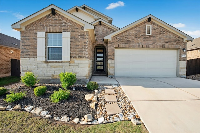 view of front of home featuring a garage, brick siding, concrete driveway, and stone siding