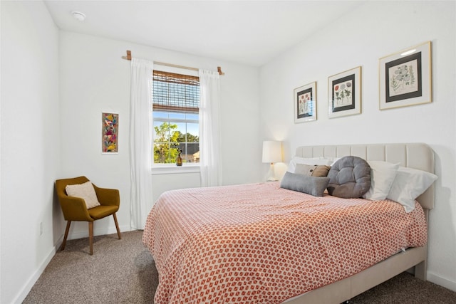bedroom with carpet and baseboards