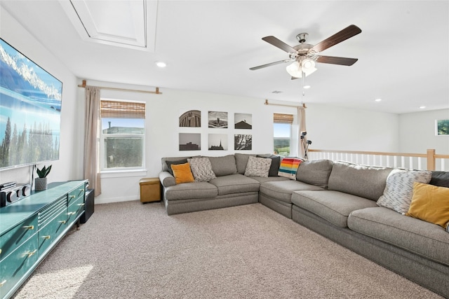 living room featuring a ceiling fan, light carpet, healthy amount of natural light, and recessed lighting