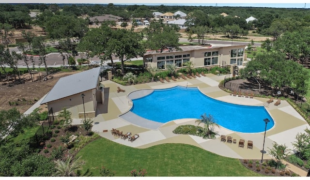 community pool featuring a yard