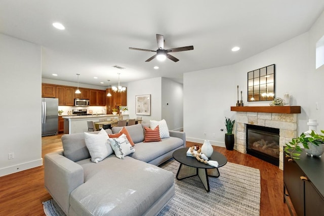 610 Fletcher St Unit A, Austin, TX 78704 - living room featuring a fireplace, light wood-style floors, recessed lighting, ceiling fan, and baseboards