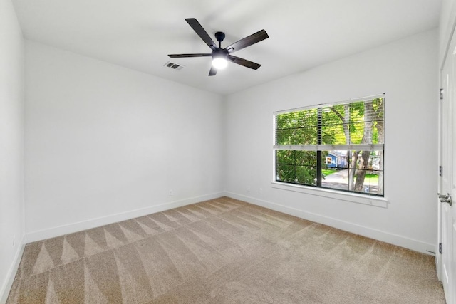 610 Fletcher St Unit A, Austin, TX 78704 - spare room with light carpet, baseboards, and ceiling fan