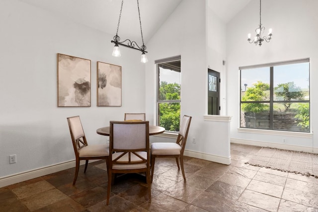 432 Stacey Ann Cv, Dripping Springs, TX 78620 - dining room with stone tile floors, a chandelier, and high vaulted ceiling