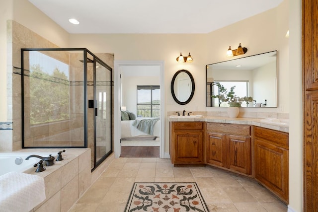 432 Stacey Ann Cv, Dripping Springs, TX 78620 - ensuite bathroom featuring a shower stall, a garden tub, and double vanity