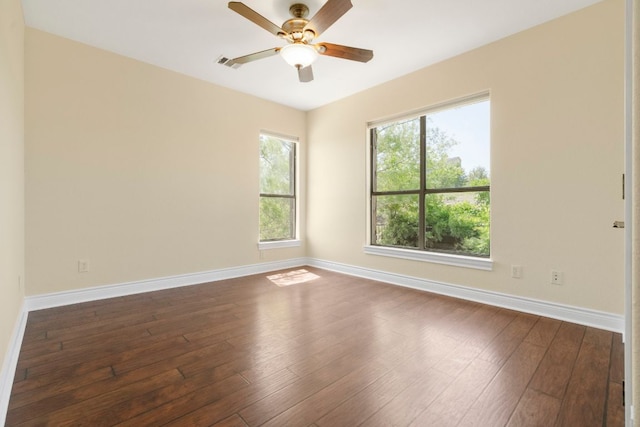 432 Stacey Ann Cv, Dripping Springs, TX 78620 - unfurnished room with dark wood finished floors, healthy amount of natural light, and ceiling fan