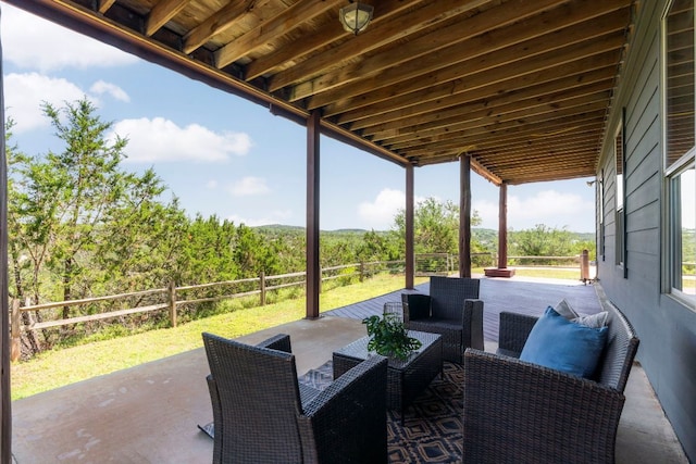 432 Stacey Ann Cv, Dripping Springs, TX 78620 - view of patio featuring an outdoor living space and a forest view