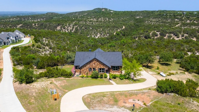 432 Stacey Ann Cv, Dripping Springs, TX 78620 - view of subject property featuring a forest
