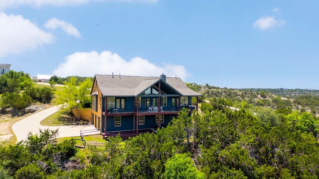 432 Stacey Ann Cv, Dripping Springs, TX 78620 - back of property with a balcony