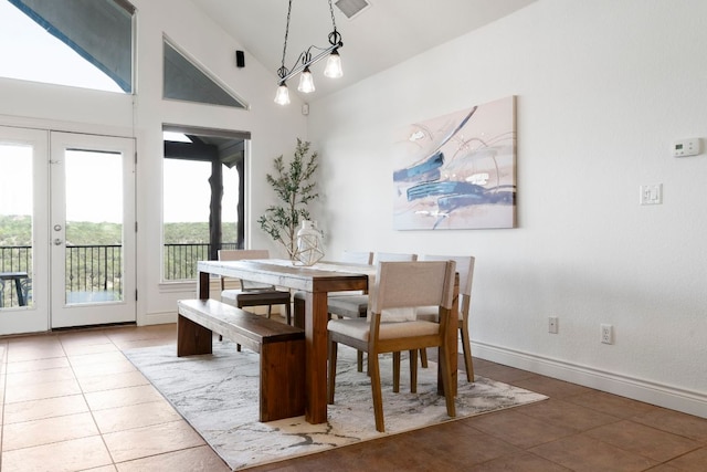 432 Stacey Ann Cv, Dripping Springs, TX 78620 - dining area featuring tile patterned floors and lofted ceiling
