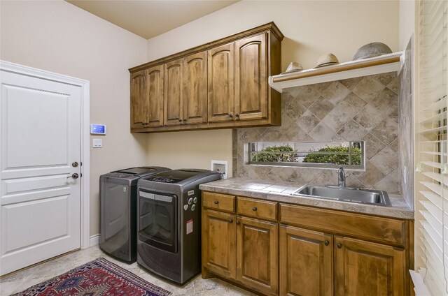 105 Hill Valley Cv, Georgetown, TX 78628 - laundry room featuring washer and dryer and cabinet space