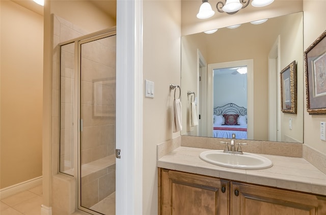 105 Hill Valley Cv, Georgetown, TX 78628 - ensuite bathroom with a stall shower, vanity, and tile patterned flooring