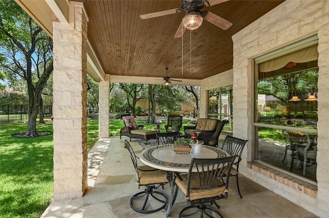 view of patio featuring ceiling fan and outdoor dining space