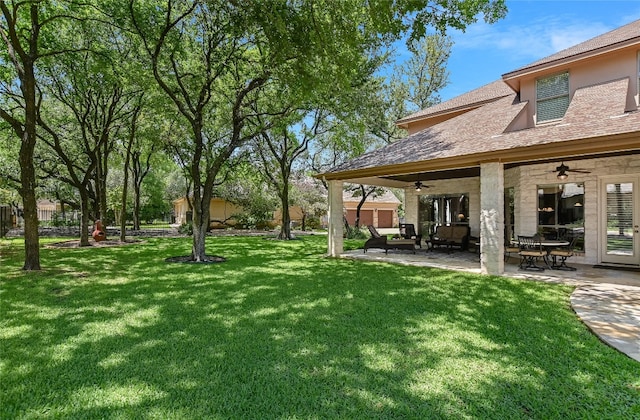 105 Hill Valley Cv, Georgetown, TX 78628 - view of grassy yard featuring a ceiling fan, a patio area, and an outdoor living space