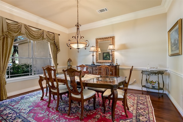 105 Hill Valley Cv, Georgetown, TX 78628 - dining area with wood finished floors, ornamental molding, and baseboards