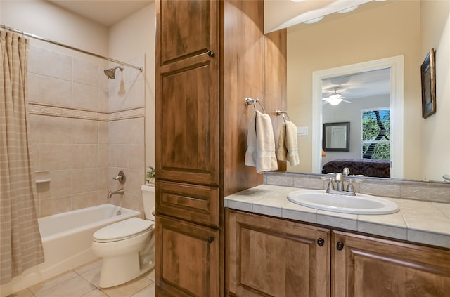 105 Hill Valley Cv, Georgetown, TX 78628 - ensuite bathroom featuring shower / bath combo, tile patterned floors, vanity, toilet, and a ceiling fan