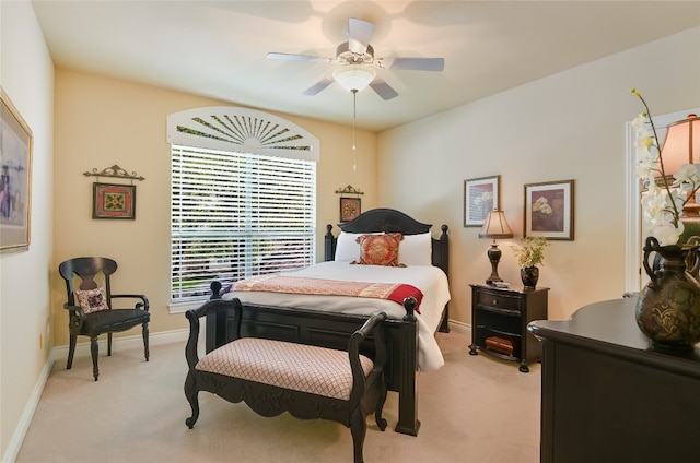 105 Hill Valley Cv, Georgetown, TX 78628 - bedroom featuring light carpet, baseboards, and a ceiling fan