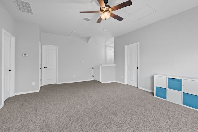407 Stone View Trl, Austin, TX 78737 - carpeted spare room with ceiling fan, baseboards, and attic access