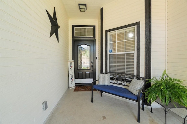 view of exterior entry with covered porch