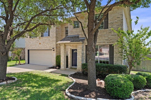 view of front of house with stone siding, a garage, concrete driveway, and a shingled roof