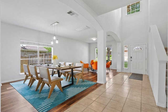 4502 Western Lake Dr, Round Rock, TX 78665 - dining room with arched walkways, plenty of natural light, baseboards, and light tile patterned flooring