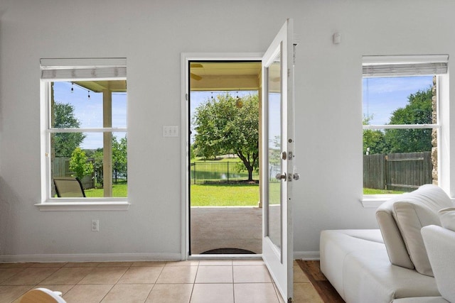entryway with baseboards and plenty of natural light