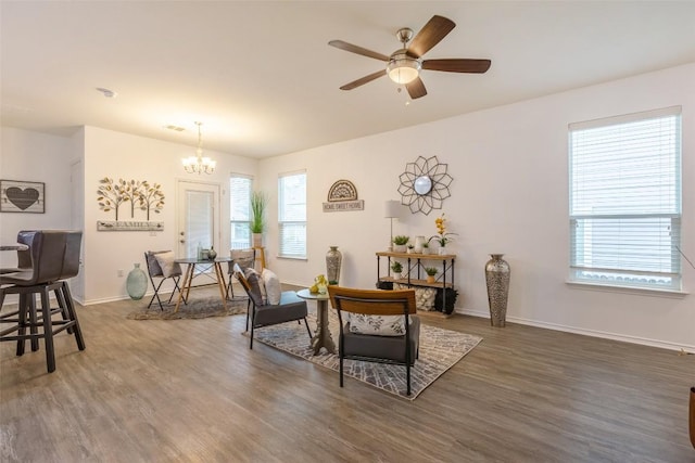 9005 Pin Brush Dr, Austin, TX 78748 - dining space featuring wood finished floors, a chandelier, ceiling fan, and baseboards